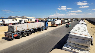 Aid trucks roll into Gaza as Hamas hands over more hostage bodies