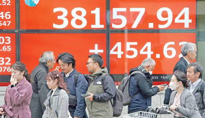 Markets mixed as traders weigh China-US row, rate cut hopes