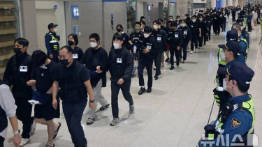 Koreans linked to alleged online scams in Cambodia arrive home to face inquiries
