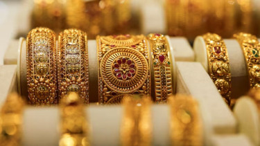 Gold extends retreat from record high on profit-booking, trade optimism