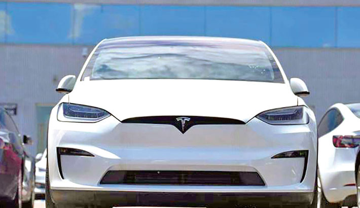 Tesla profits tumble on higher costs, tariff drag