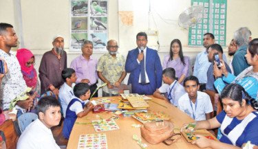 Narayanganj Deputy Commissioner Mohammad Zahidul Islam Miah on Wednesday visits SWED School for the mentally challenged children on Shayesta Khan Road in Narayanganj city. During his visit, he handed over flowers, chocolates, and sweets to the children. 	 -  DAILY SUN PHOTO