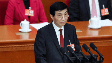 Top China official says peaceful 'reunification' with Taiwan is best path forward