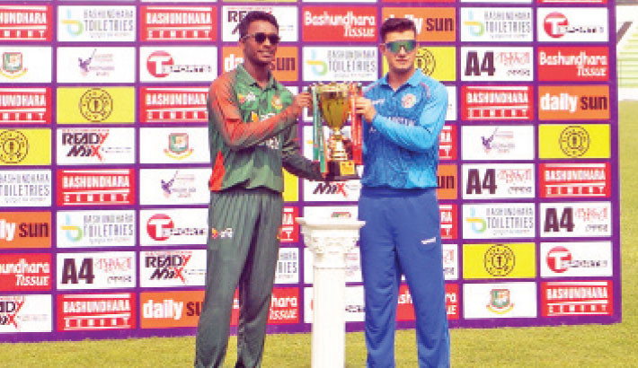 Azizul Hakim Tamim and Mahbub Khan, the skippers of Bangladesh and Afghanistan U-19 cricket teams, unveil the trophy on the day before the 1st ODI of the two-match series in Bogura on Monday. - BCB PHOTO