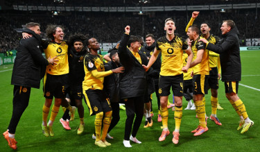 Kobel makes a vital save as Dortmund beats Frankfurt on penalties