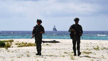 Chinese military tracks Philippine patrol in South China Sea