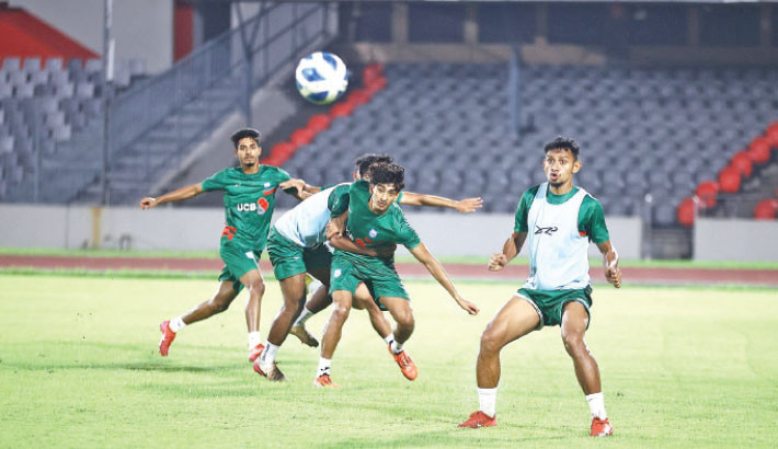 Bangladesh footballers train ahead of their AFC Asian Cup Qualifiers against India at the National Stadium on Sunday.  BFF Photo