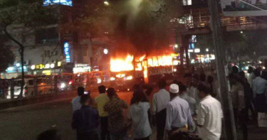 Bus set on fire near Labaid Hospital in Dhanmondi