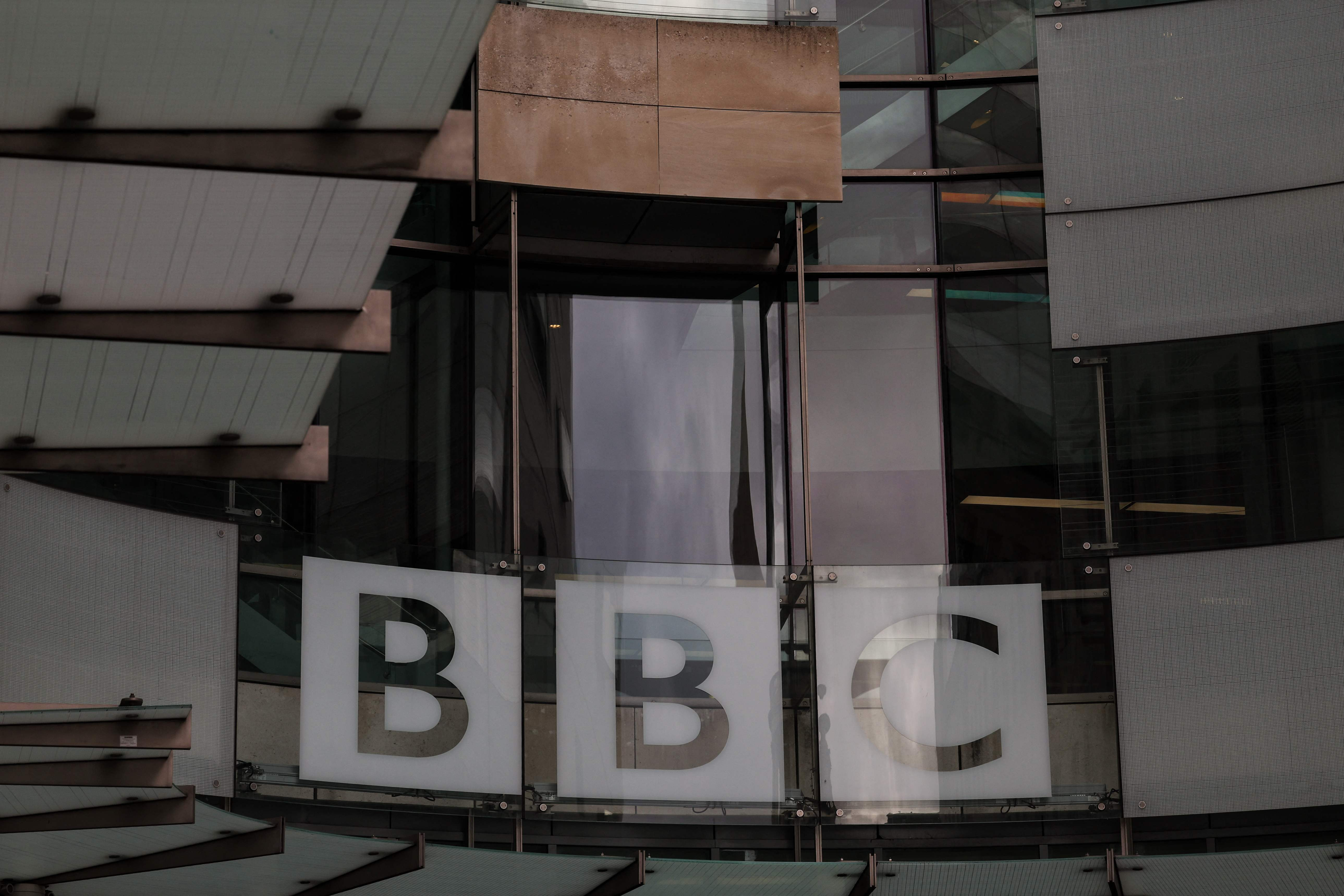 BBC must fight, says outgoing chief as Trump threatens to sue
