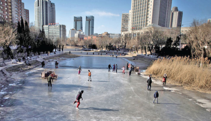 Skating into prosperity -- people ice skate on a frozen river in Beijing, 21 January 2017.